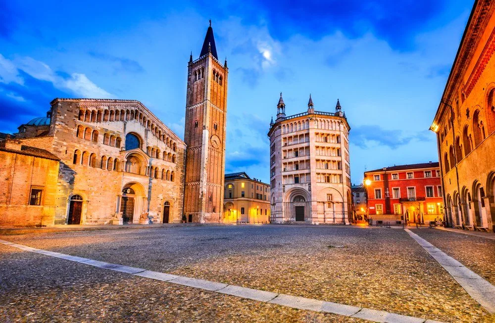 Parma, Italy - Piazza del Duomo with the Cathedral and Baptistery, built in 1059. Romanesque architecture in Emilia-Romagna.