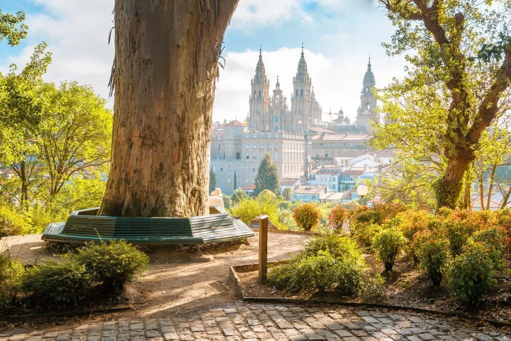 Santiago de Compostela Cathedral at sunrise, public park panorama, Galicia, Spain