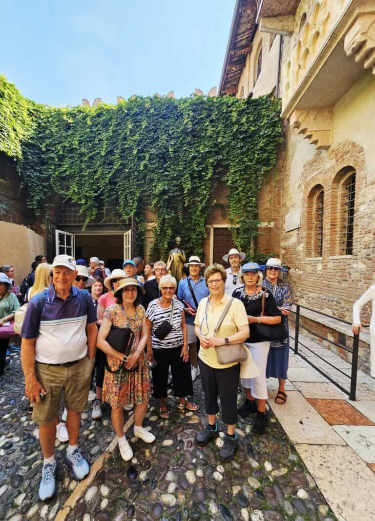 Secret Italia guests in the Juliet's House courtyard, Verona