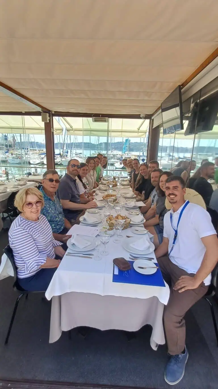 Secret Italia group enjoying a seafood lunch overlooking the harbour